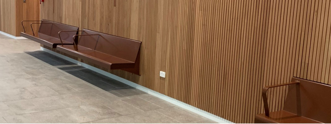 seating along a wall covered in wooden slats