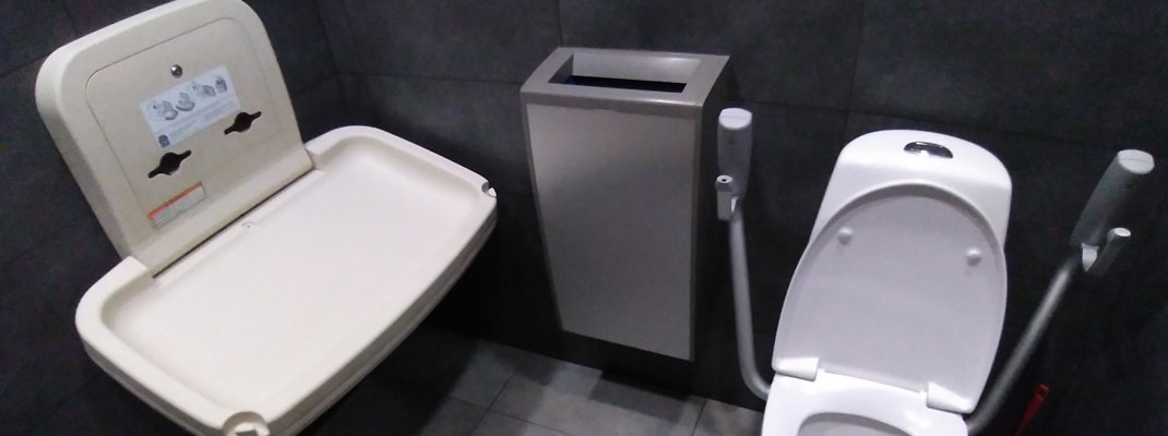 Baby change station in accessible bathroom